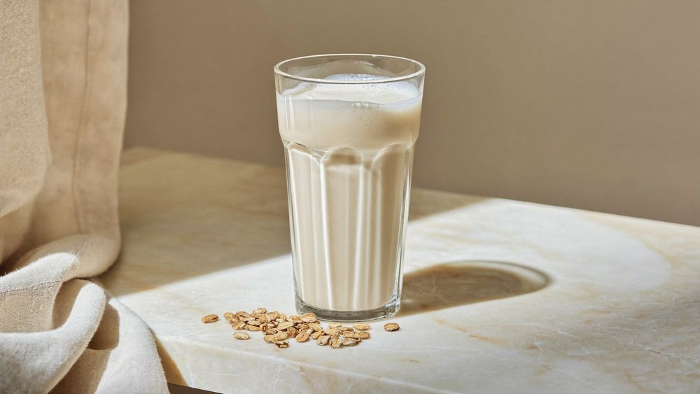 A glass of smooth protein shake on a stone counter