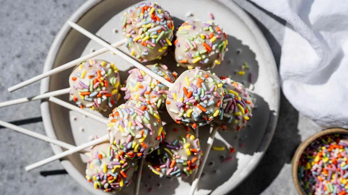 Birthday cake protein cake pops with rainbow sprinkles
