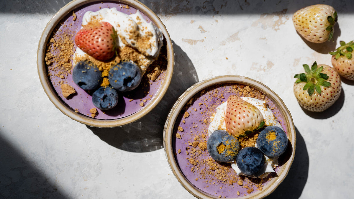 Lemon blueberry protein mousse in ramekins topped with berries