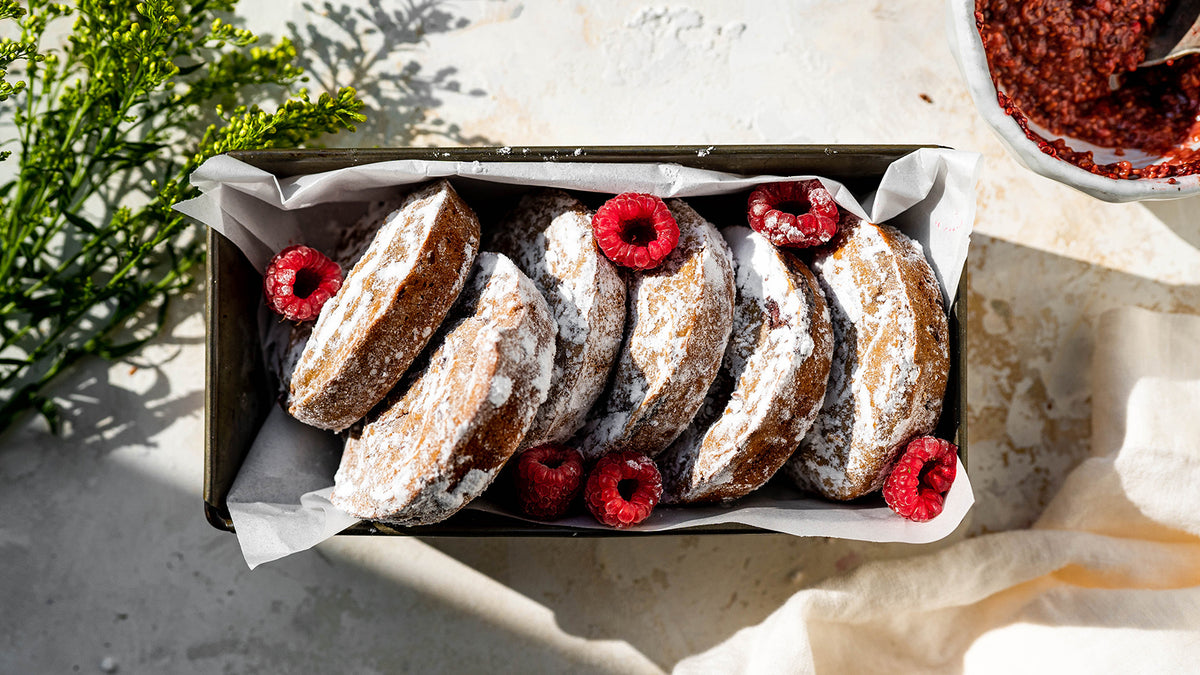 Raspberry chia jelly protein donuts dusted with powdered sugar