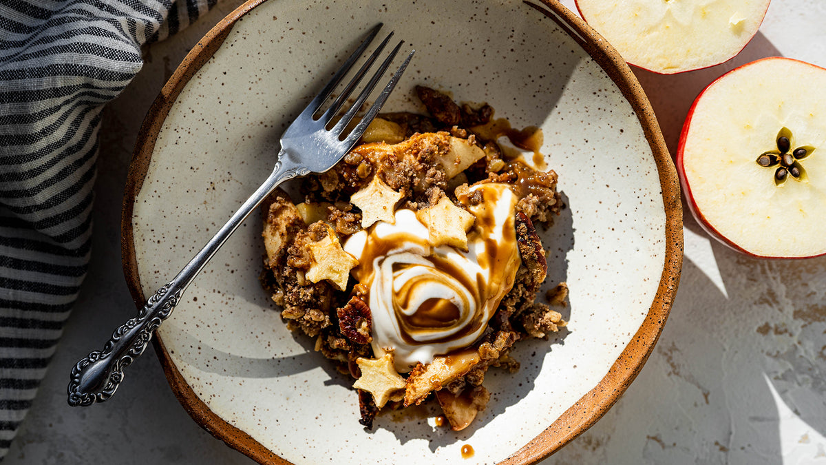 Caramel apple protein crisp in a bowl with yogurt
