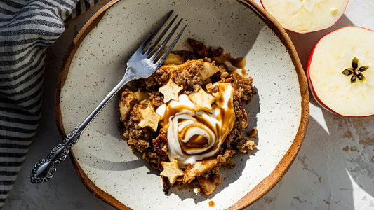Caramel apple protein crisp in a bowl with yogurt