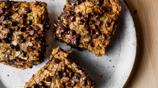 Brown sugar oatmeal protein bars with chocolate chips on a speckled plate