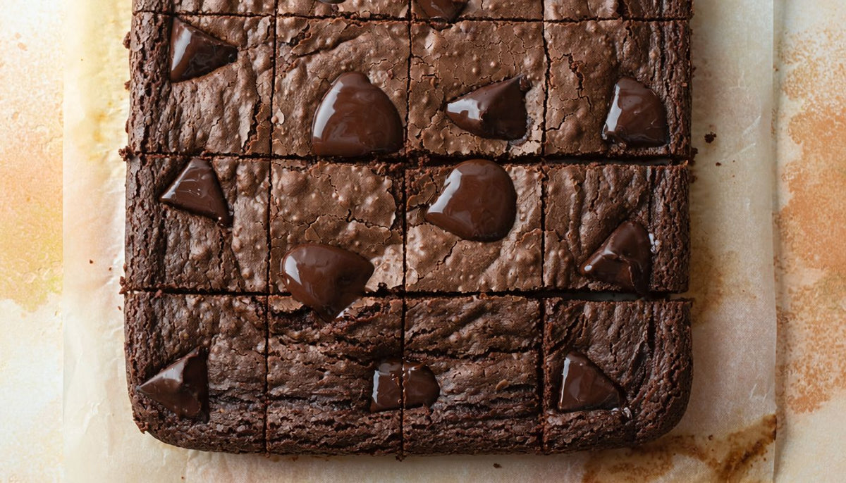 Fudgy dark chocolate chunk protein brownies cut into squares