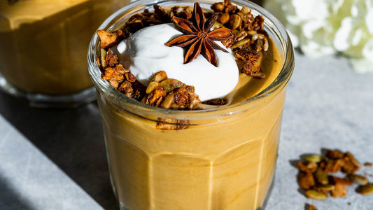 Sweet potato pie protein smoothie topped with granola and star anise
