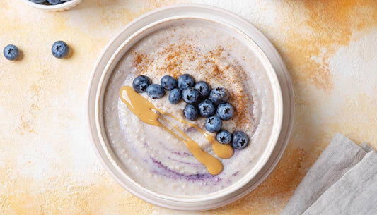 Blueberry cream of wheat bowl topped with blueberries and cinnamon