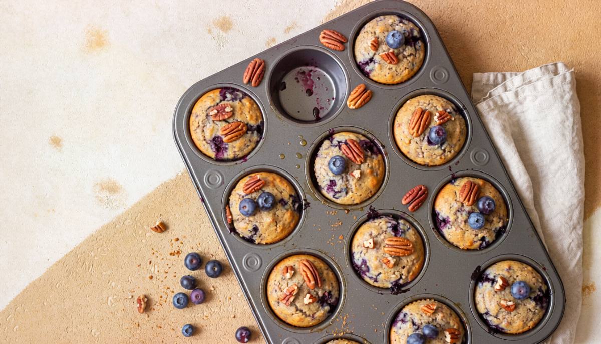 Vegan blueberry protein muffins in a muffin tin